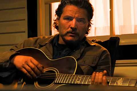 Joel playing guitar in the last of us tv show