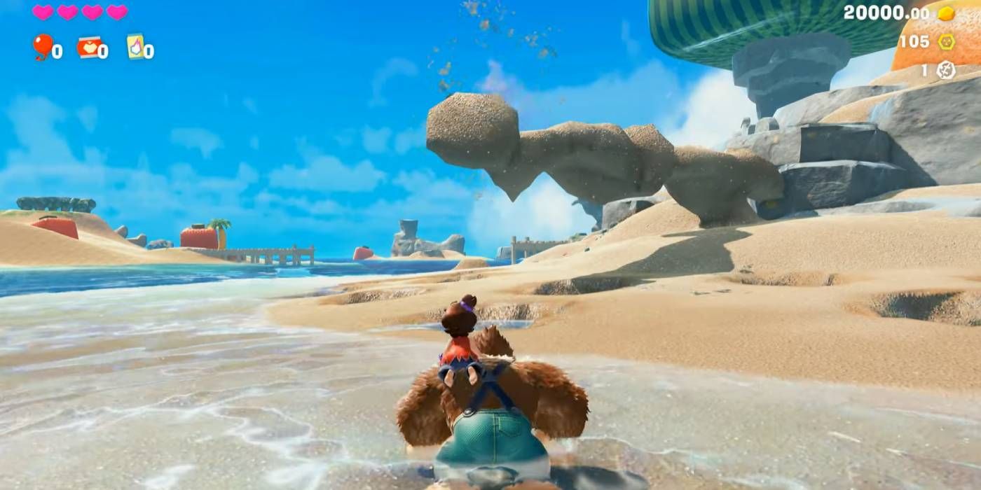 Donkey Kong building a bridge on the beach in Donkey Kong Bananza