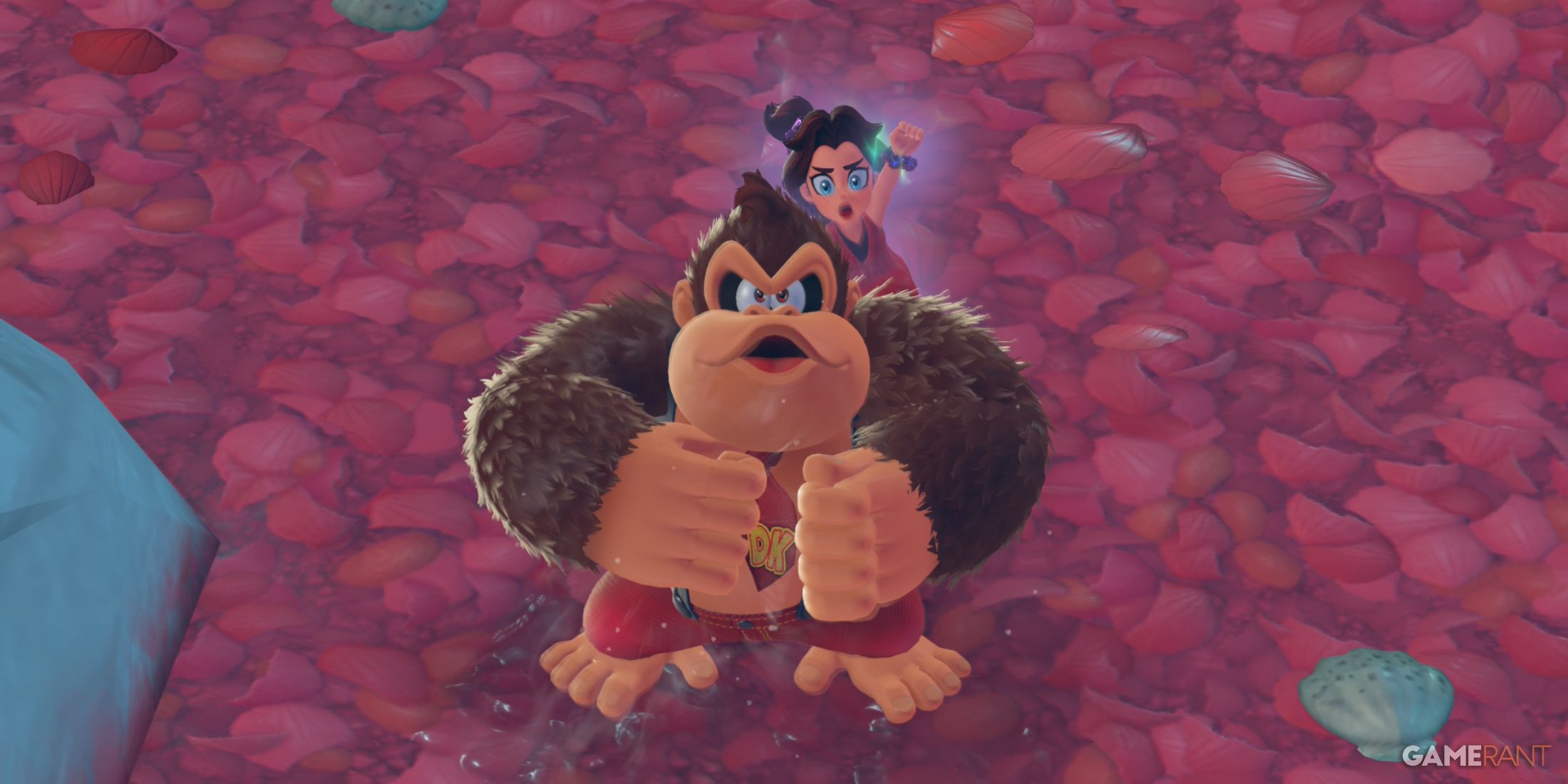 Donkey Kong jumps with clenched fists while Pauline sings behind in Donkey Kong Bananza